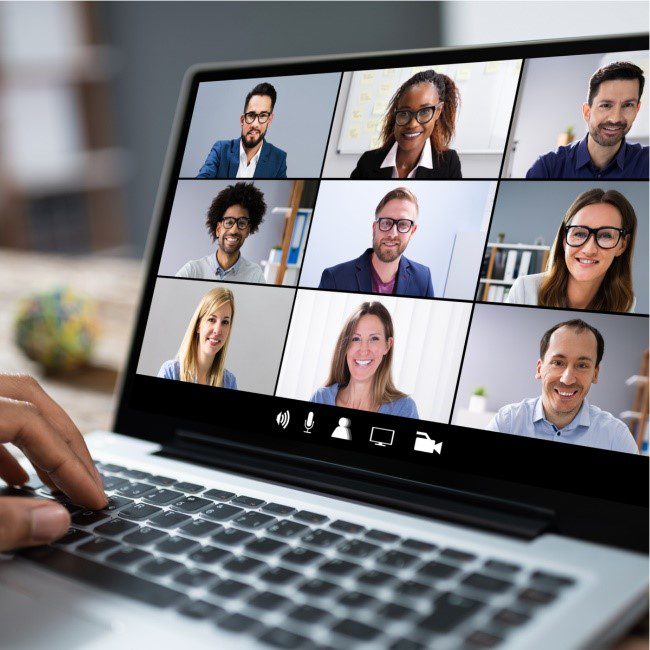 A group of employees in a virtual meeting