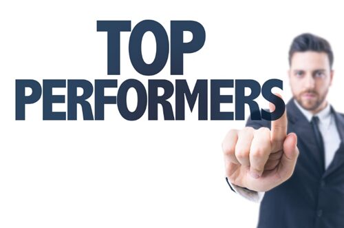 A man pointing to the word Top Performers